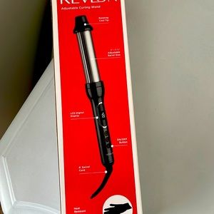 Curling iron with an adjustable barrel size. The box has never been opened